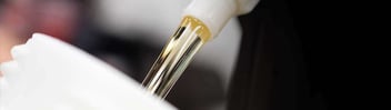 Foodgrade oil pouring from container: lubrication as part of global asset care strategy